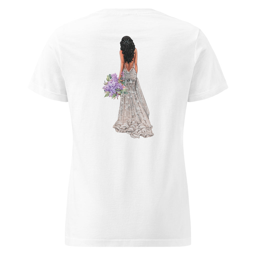 Back side view of white t-shirt with large image of bride medium skin, long dark hair, in a lace wedding dress, low back, holding a purple bouquet.