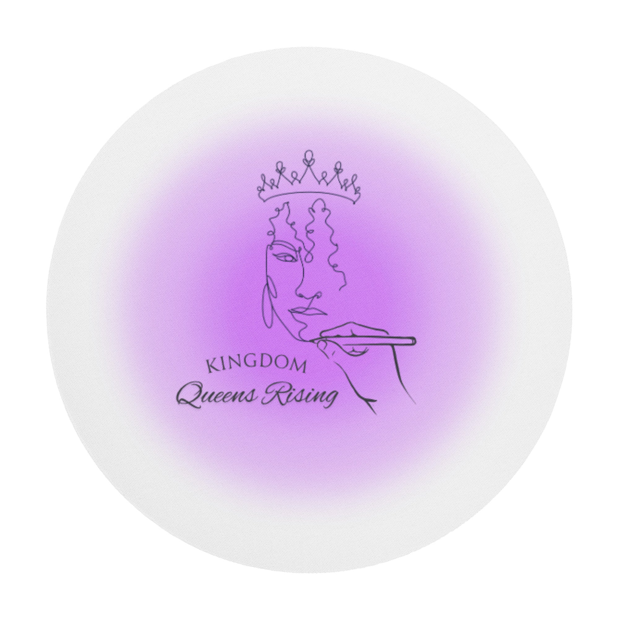 Desktop mouse pad with hand holding a pencil drawing a woman's face wearing a crown and Kingdom Queens Rising in fancy letters to the bottom left of image finished with a purple faded round spot in the center.